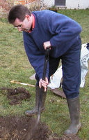 Darren planting a tree at Saffron Walden hostel